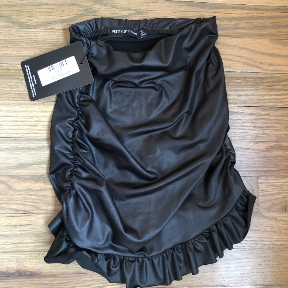 Shiny black mini skirt brand new